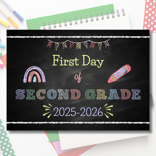 Sign for the 'First Day of Second Grade 2025-2026' with colorful text and decorations on a blackboard background.
